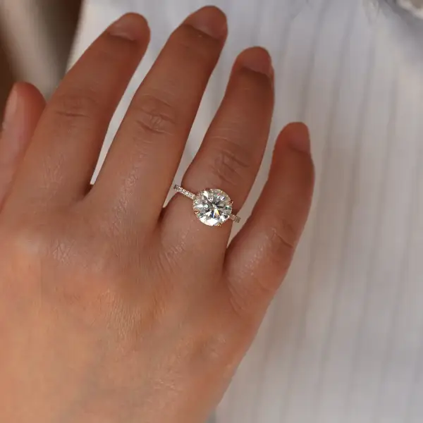 4.5 ct Brilliant round Moissanite with hidden halo and pavé band