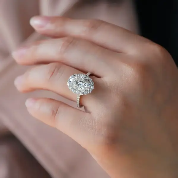 4.5ct Oval with halo and half eternity pavé band