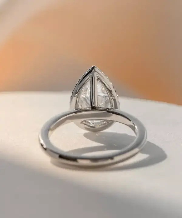 3 ct Pear cut Moissanite with halo and plain band