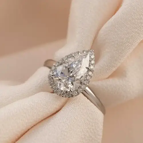 3 ct Pear cut Moissanite with halo and plain band