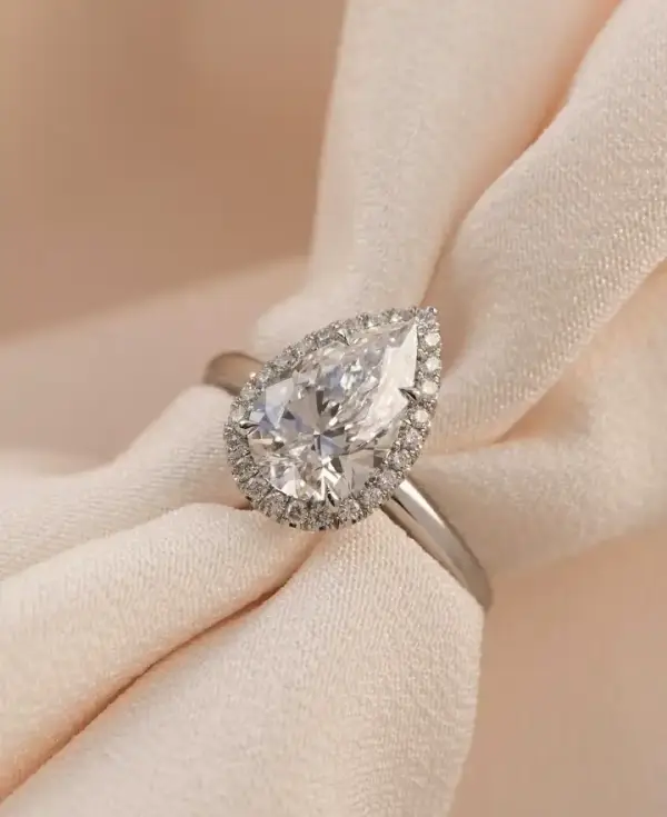 3 ct Pear cut Moissanite with halo and plain band