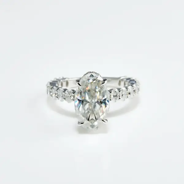 5.3ct Crushed ice Oval Moissanite with hidden halo and half eternity round Moissanite pavé Band - Image 3