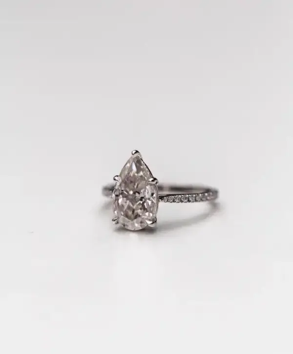 4.1 Ct 12.75x7.75mm Crushed Ice Hybrid Pear Cut Moissanite with Half Eternity Pavé Band