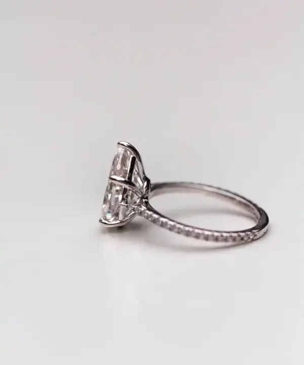 4.1 Ct 12.75x7.75mm Crushed Ice Hybrid Pear Cut Moissanite with Half Eternity Pavé Band