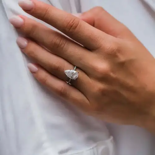 4.1 Ct 12.75x7.75mm Crushed Ice Hybrid Pear Cut Moissanite with Half Eternity Pavé Band