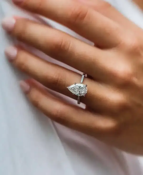 4.1 Ct 12.75x7.75mm Crushed Ice Hybrid Pear Cut Moissanite with Half Eternity Pavé Band
