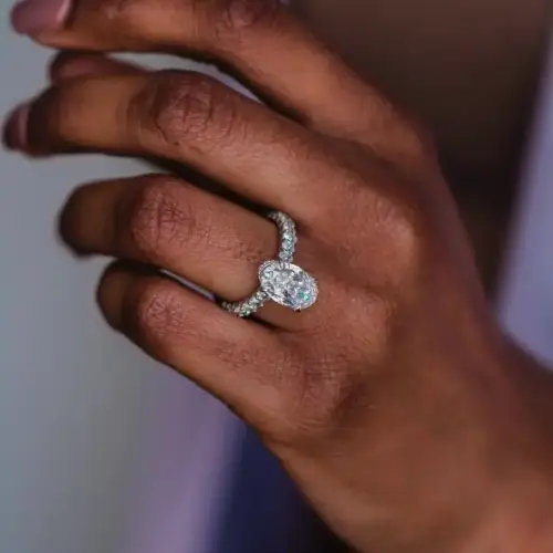 5.3ct Crushed ice hybrid Oval Moissanite with hidden halo and half eternity round Moissanite pavé Band