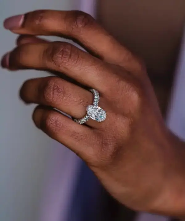5.3ct Crushed ice hybrid Oval Moissanite with hidden halo and half eternity round Moissanite pavé Band