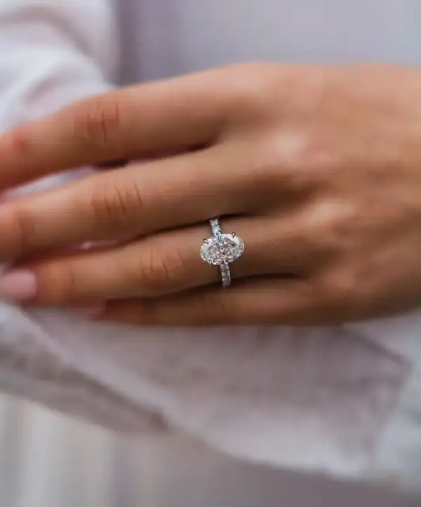 2.9 Ct 10.5x7mm Skinny Crushed Ice Hybrid Oval Cut Moissanite with hidden halo and round Moissanite pavé band