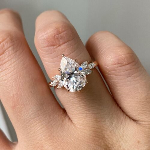 4ct Pear Moissanite with Marquise Cluster Side Stones