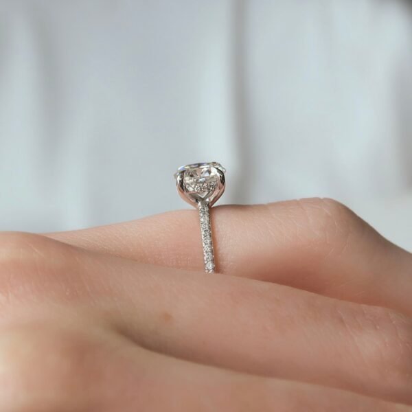 1.5ct Brilliant Round Moissanite in a 4 Claw Solitaire With a Hidden Halo and Half Eternity Pavé Band - Image 4