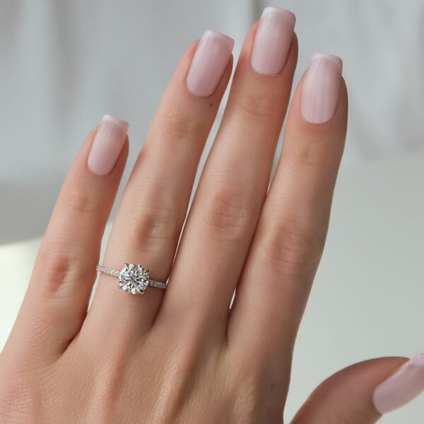 1.5ct Brilliant Round Moissanite in a 4 Claw Solitaire With a Hidden Halo and Half Eternity Pavé Band - Image 3