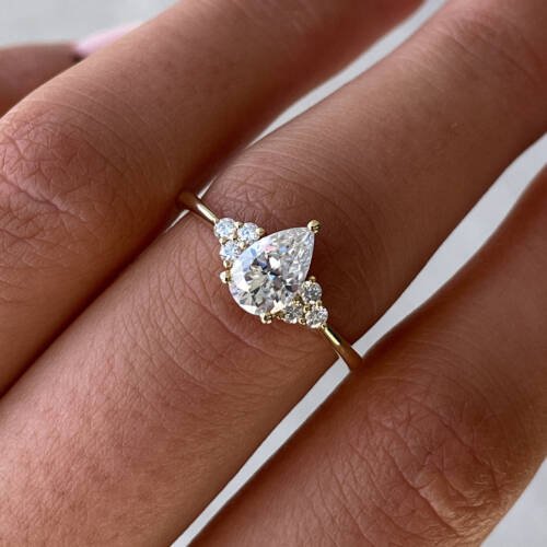 1ct Pear Moissanite with Cluster Stones