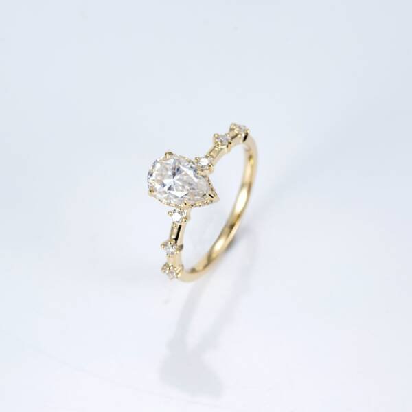 1.5ct Pear Moissanite With Hidden Halo & Accent Band